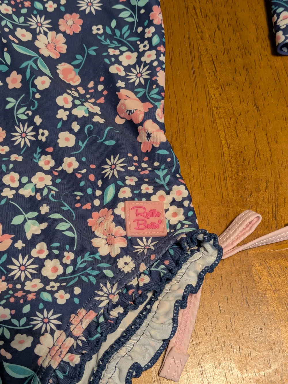 Ruffle Butts Navy Floral Long-Sleeve Swim Suit with Pink Trim